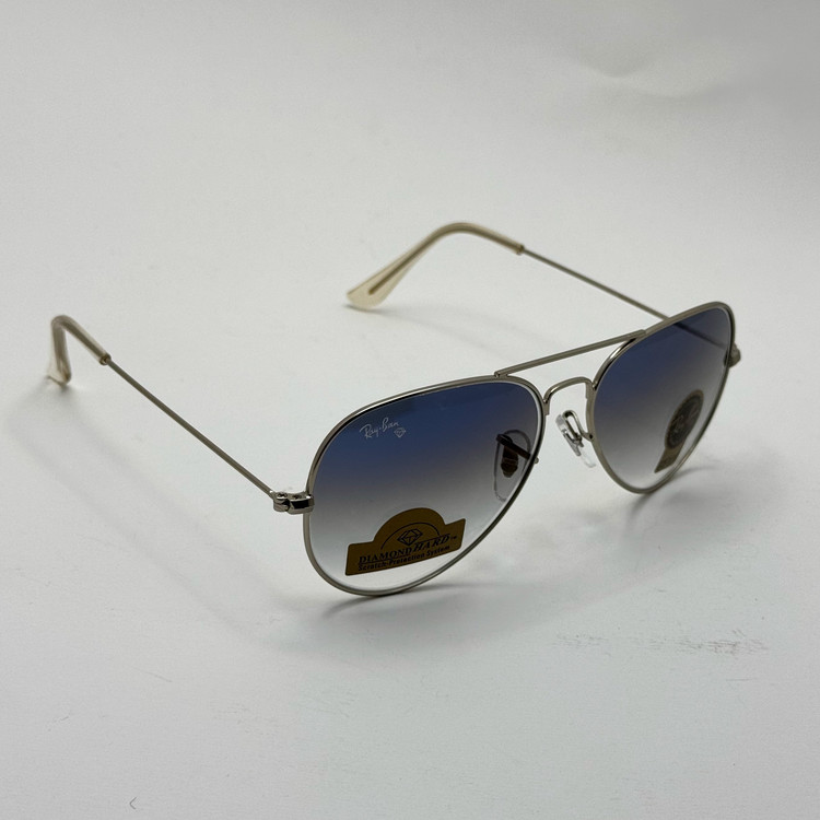 عینک ریبن خلبانی شیشه سنگ آبی هایلایت فریم نقره ای به همراه پک کامل ریبن کد Rayban RB 3025 (ارسال رایگان)
